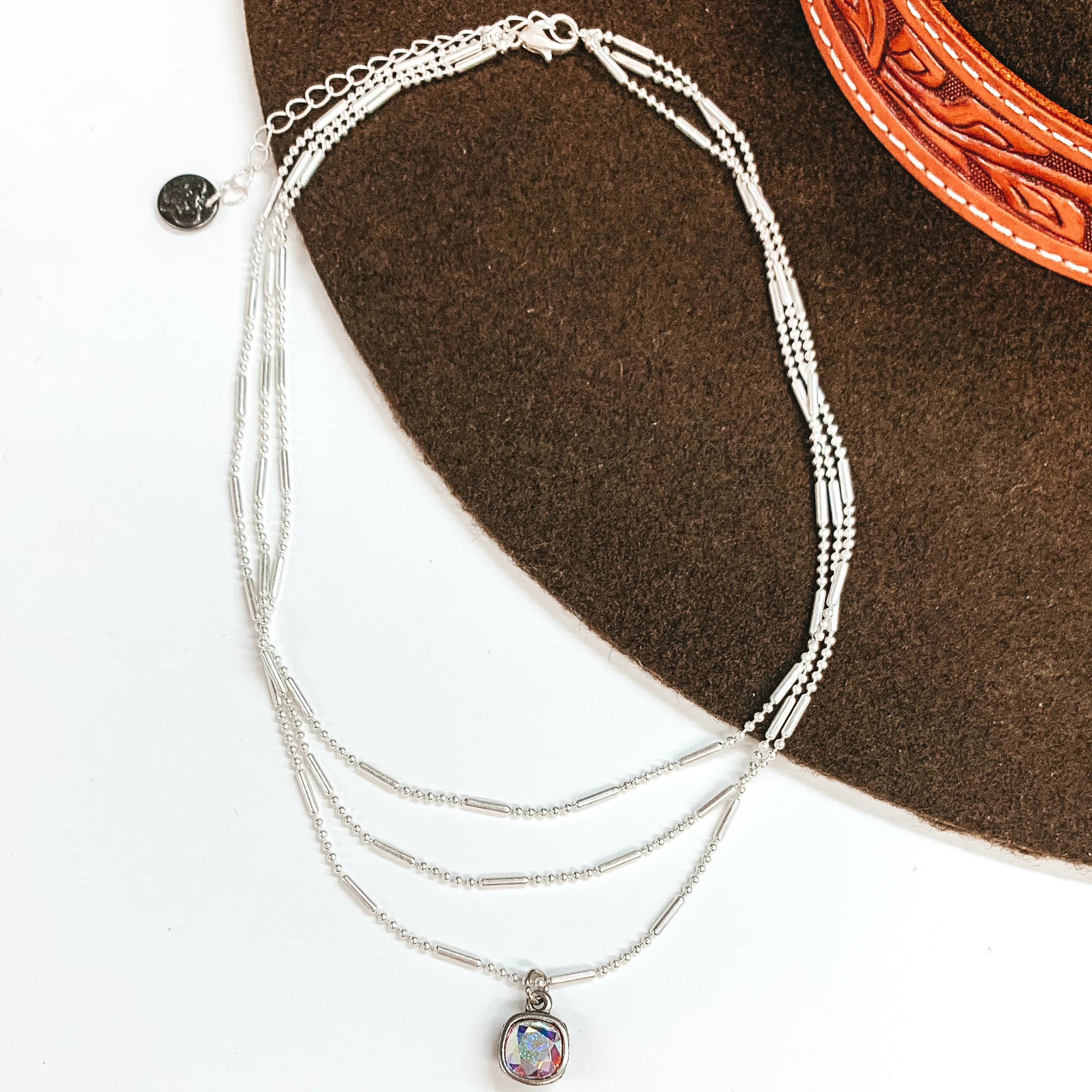 Pink Panache | Three Strand Silver Dot and Bar Chain Necklace with AB Cushion Cut Crystal Drop